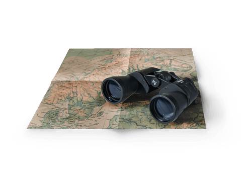 Binoculars rested on Map